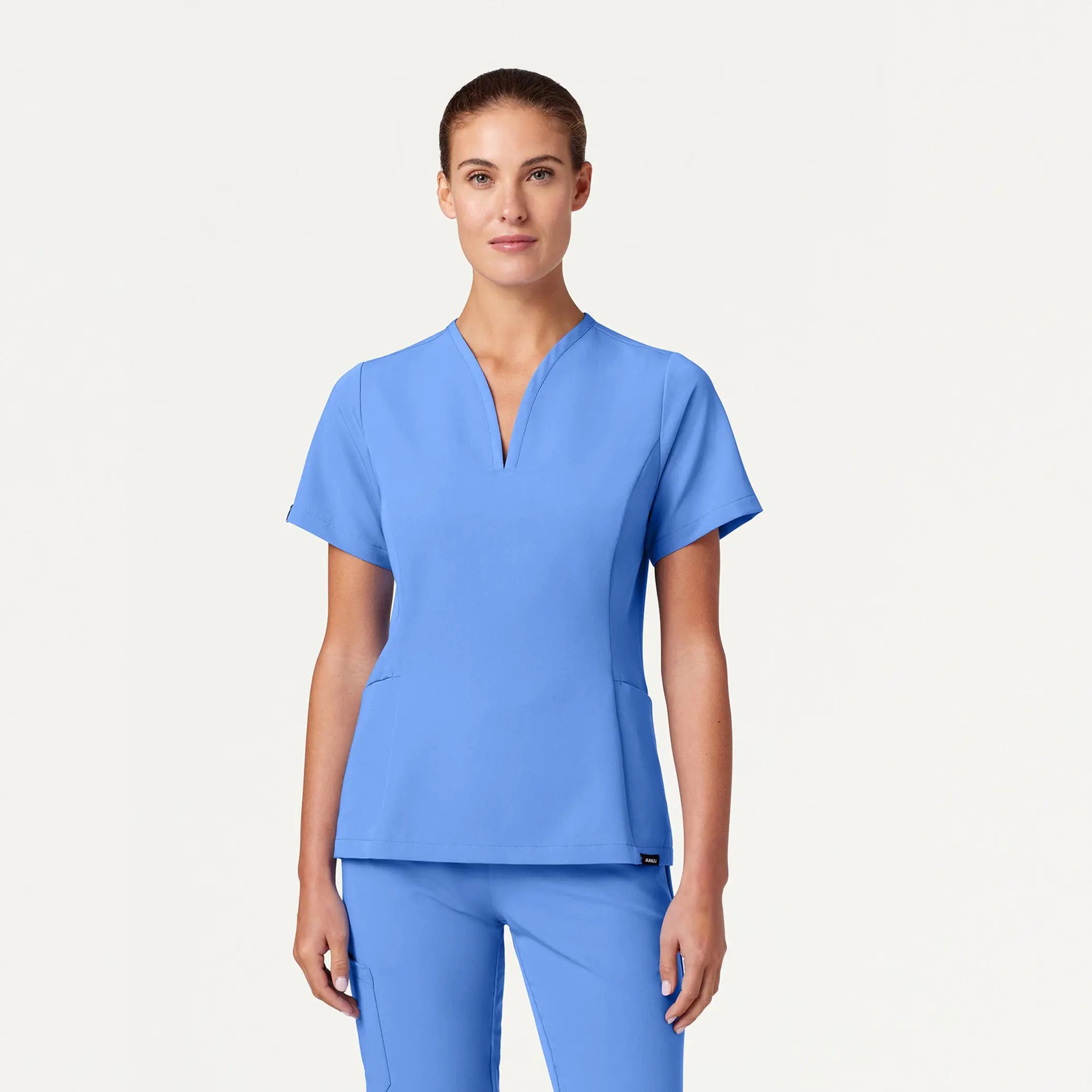 Jaanuu Women's Calix Fit & Flare Scrub Top - Ceil Blue